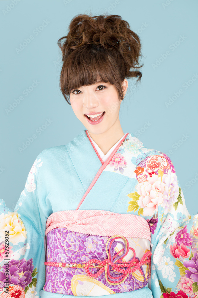 Beautiful asian kimono woman on blue background Beautiful asian kimono woman on blue background