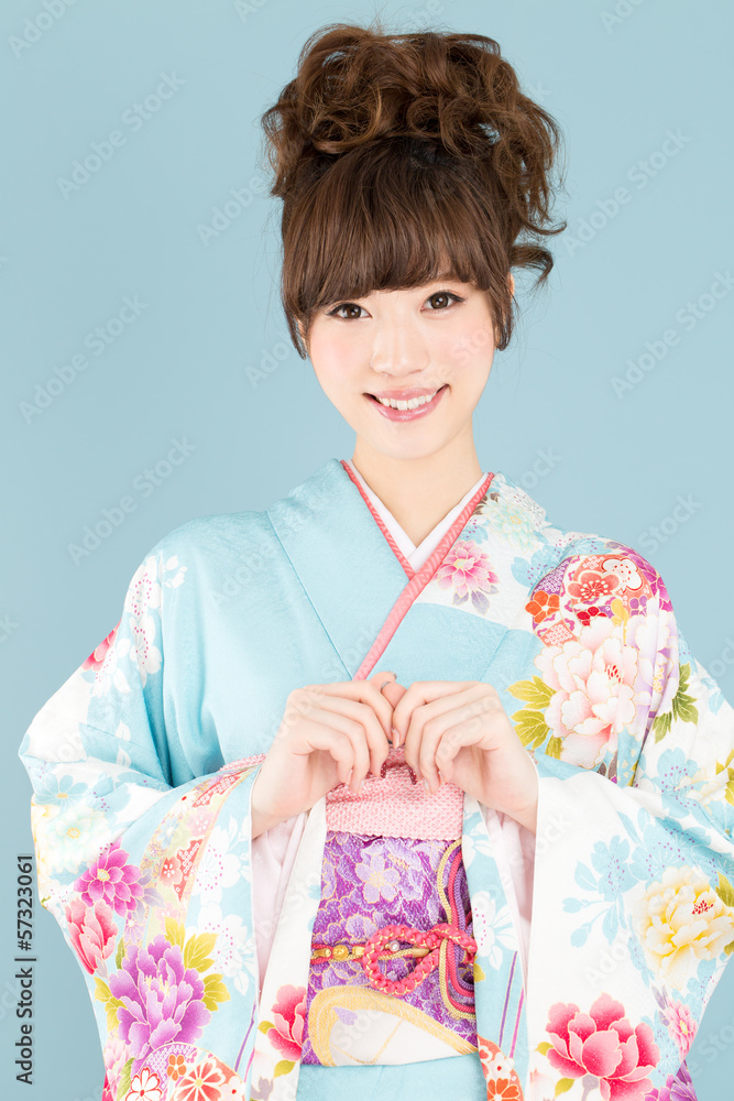 Beautiful asian kimono woman on blue background Beautiful asian kimono woman on blue background