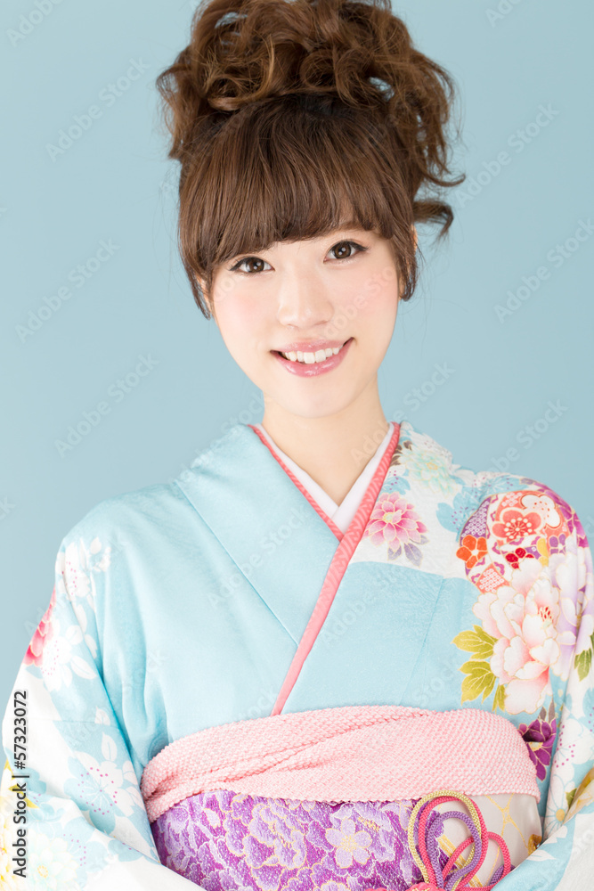 Beautiful asian kimono woman on blue background Beautiful asian kimono woman on blue background