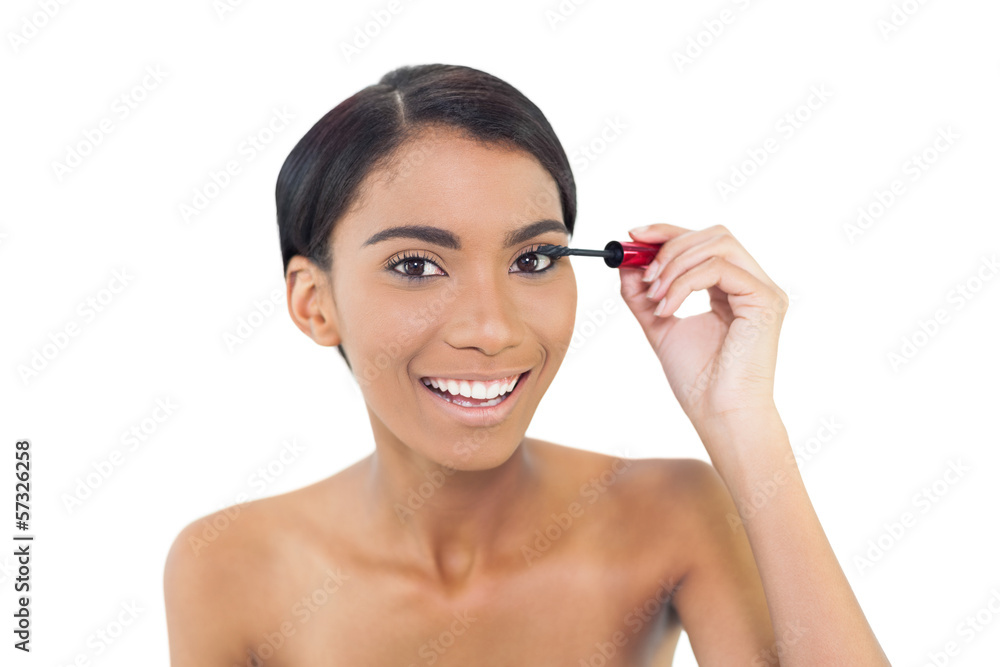 Pretty natural model applying mascara