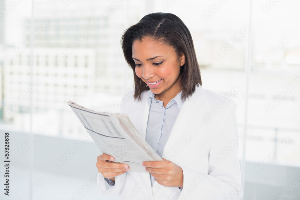 © lightwavemedia - Attentive young dark haired businesswoman reading a document
