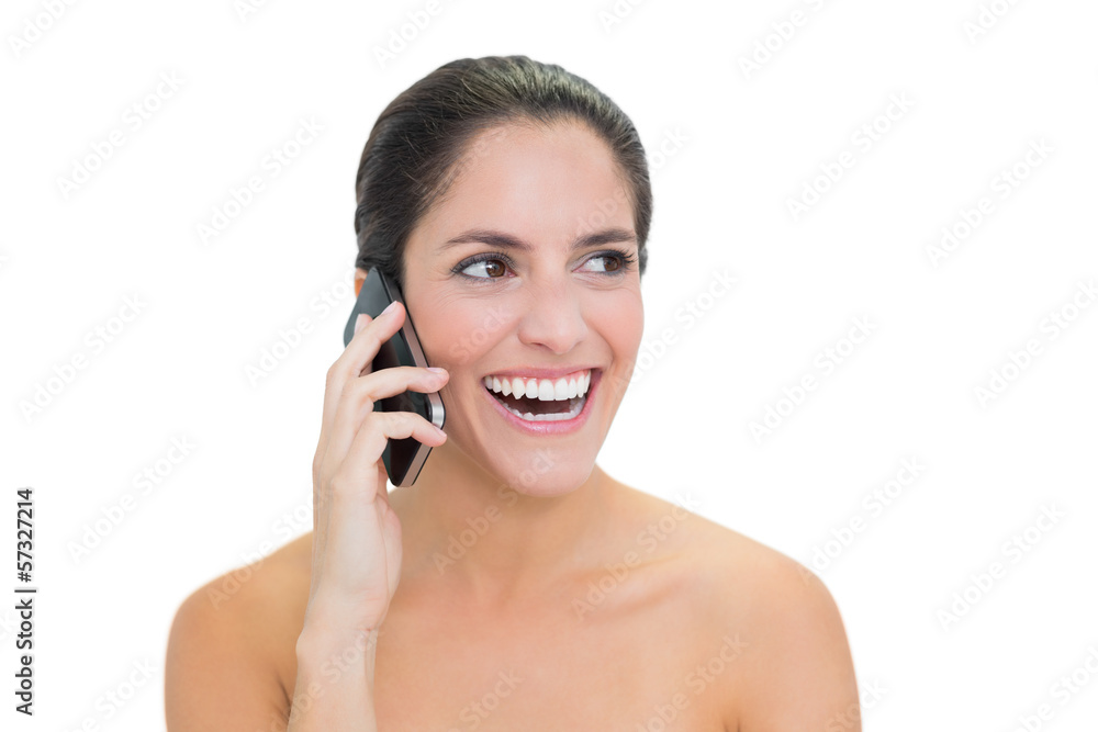 Laughing bare brunette phoning Laughing bare brunette phoning