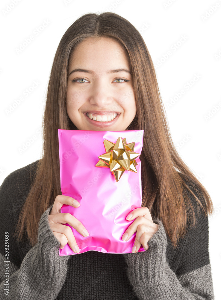 Attractive young woman holding pink present Attractive young woman holding pink present