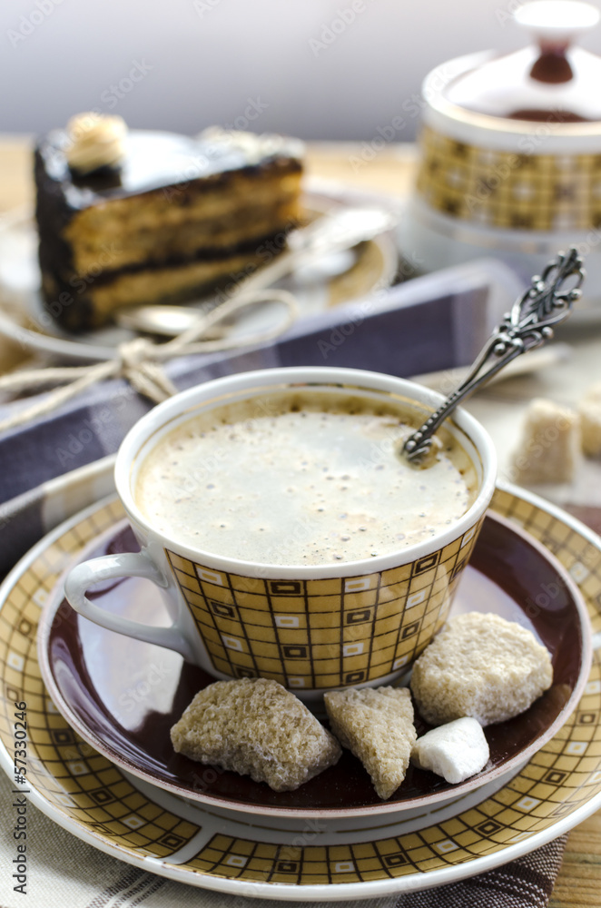 Coffee, brown sugar and piece of chocolate caramel cake Coffee, brown sugar and piece of chocolate caramel cake