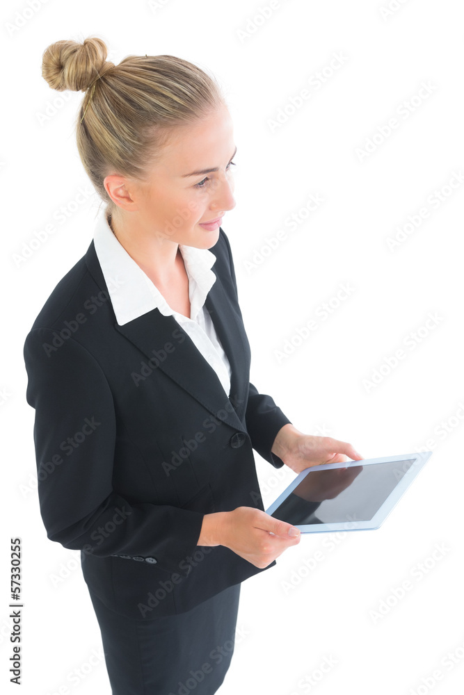 High angle view of attractive businesswoman holding her tablet High angle view of attractive businesswoman holding her tablet