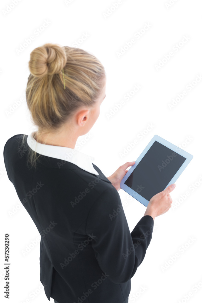 Beautiful blonde businesswoman using her tablet Beautiful blonde businesswoman using her tablet
