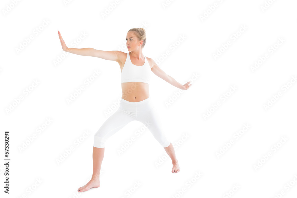 Toned focused blonde doing yoga exercise