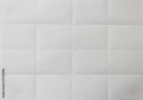 paper folded into 16 cells. Background