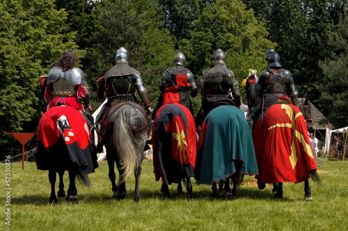 5 medieval knights on horsebacks