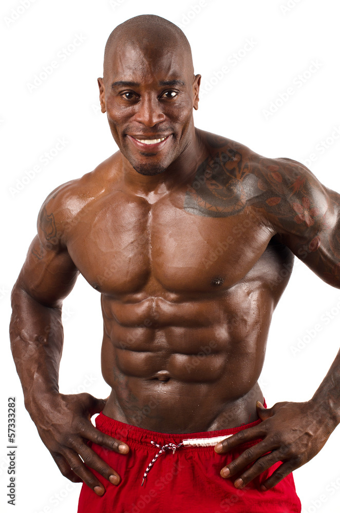Confident black bodybuilder smiling Confident black bodybuilder smiling