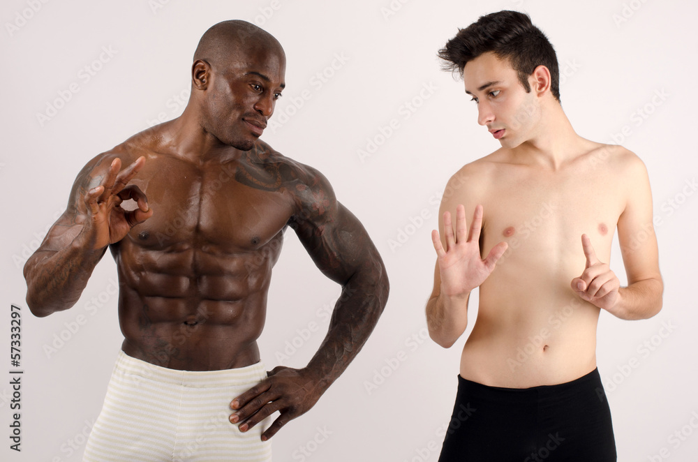 Two man, black and white, bodybuilder and a slim guy Two man, black and white, bodybuilder and a slim guy