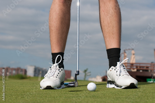 golf ball on green grass prepare