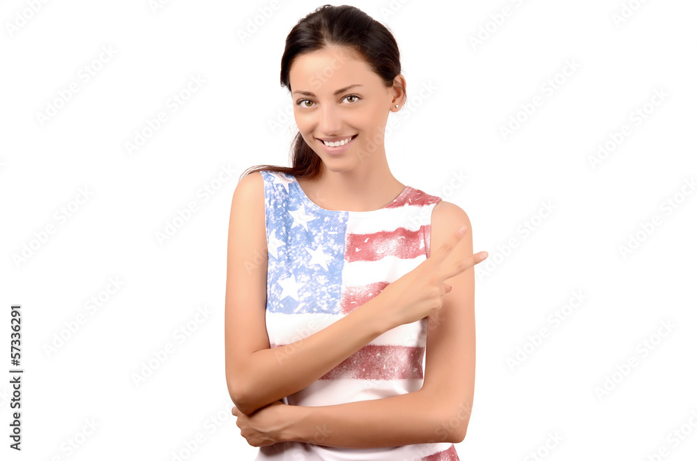 Beautiful American girl signing victory.USA flag on her blouse. Beautiful American girl signing victory.USA flag on her blouse.