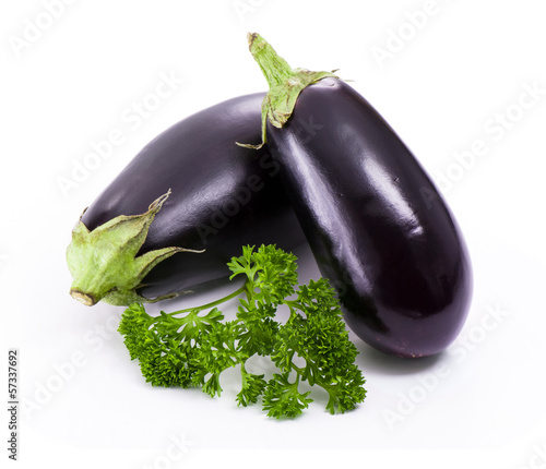 Fresh eggplant with parsley branch on white background