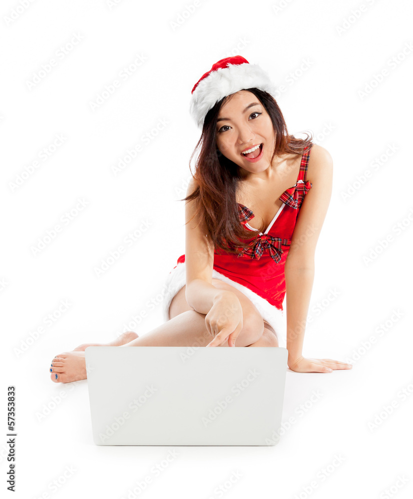 Sexy asian santa claus sitting with laptop and surprised Sexy asian santa claus sitting with laptop and surprised