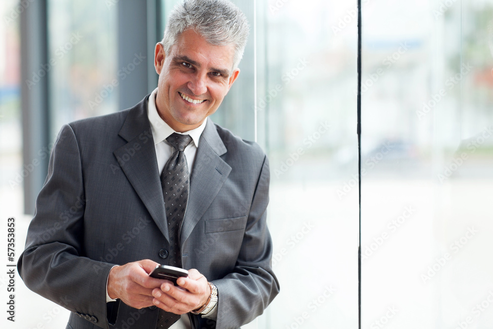 senior businessman using cell phone senior businessman using cell phone