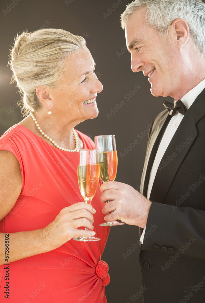 Smiling Couple Toasting Champagne Flutes Smiling Couple Toasting Champagne Flutes