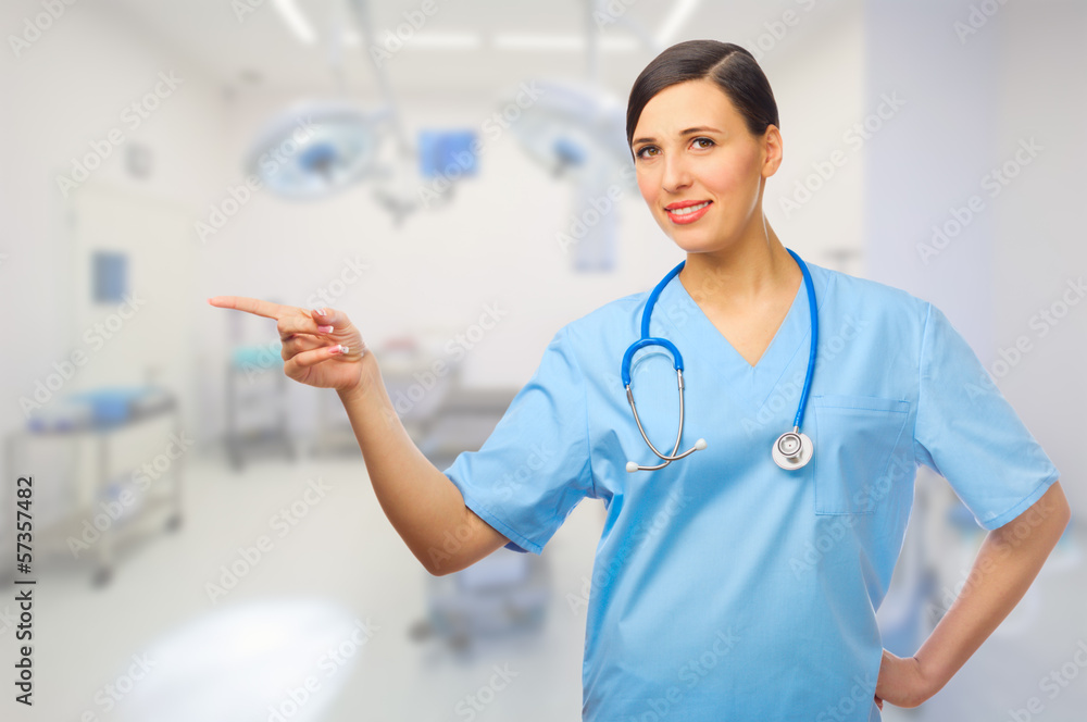 Young doctor shows pointing gesture Young doctor shows pointing gesture