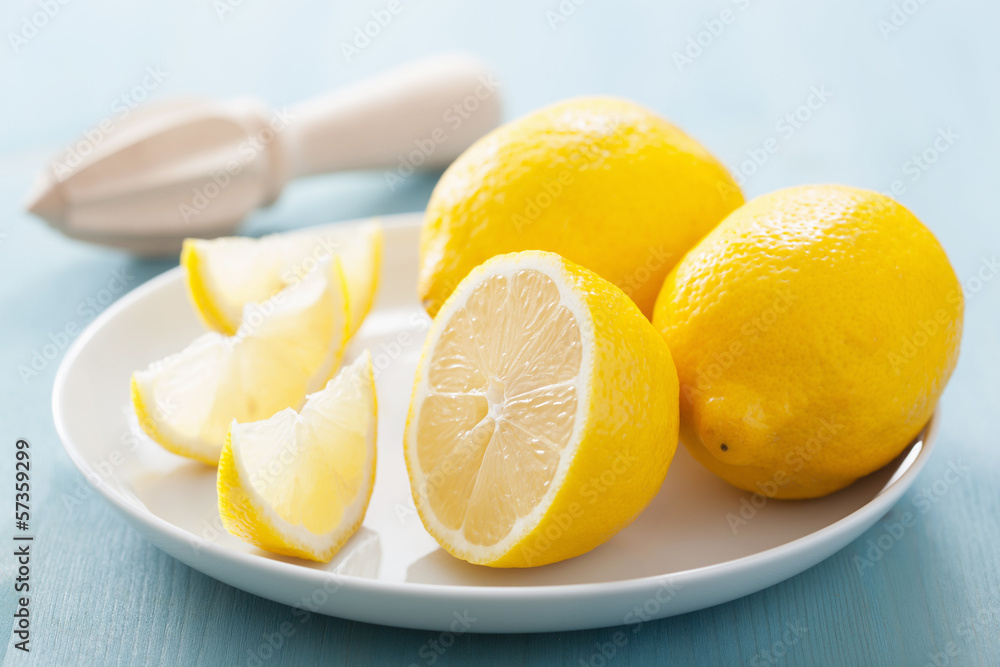 fresh lemon sliced over blue