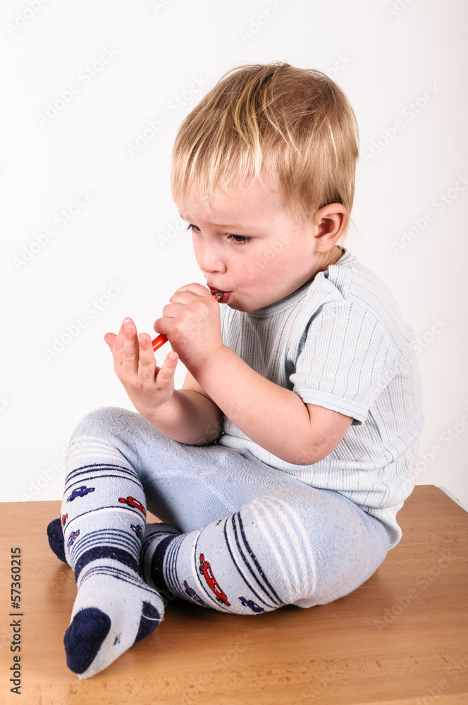 boy sitting on the table getting medicine boy sitting on the table getting medicine