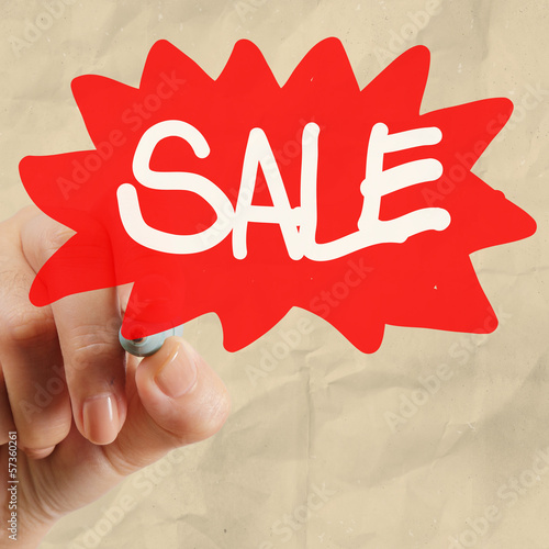 word sale with crumpled pape rbackground photo