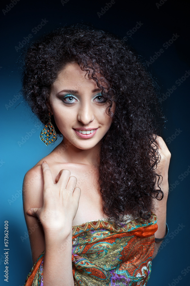 Fototapeta premium Beautiful young woman with curly hair