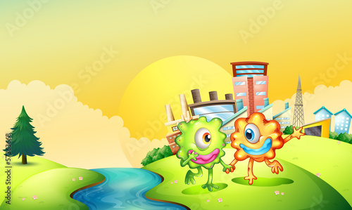 Two one-eyed monsters playing at the riverbank