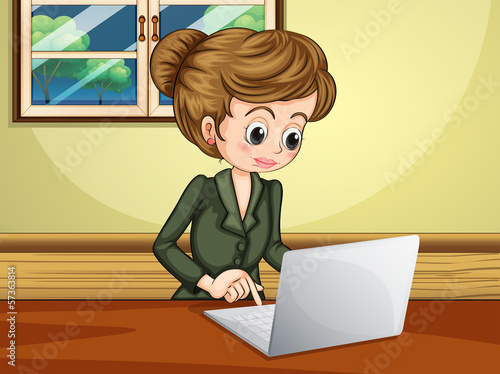 A lady using the laptop near the window