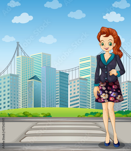 A tall woman standing near the pedestrian lane