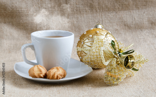 Glass cup with cookies near decoration toys photo