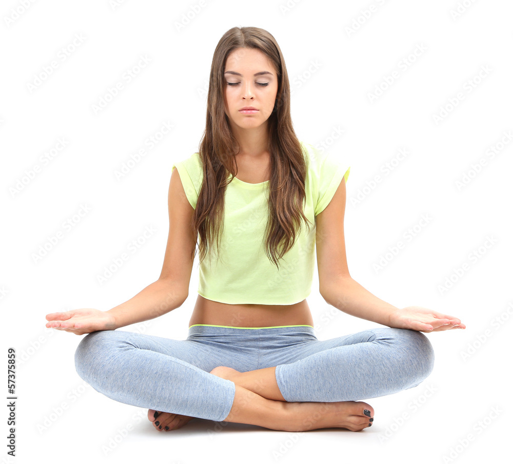 Young beautiful fitness girl doing yoga exercise isolated Young beautiful fitness girl doing yoga exercise isolated