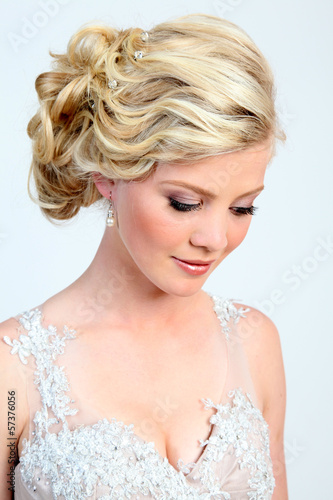Beautiful, young blond woman in evening dress.