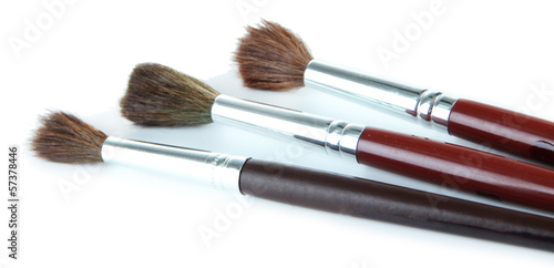 Three paint brushes isolated on white