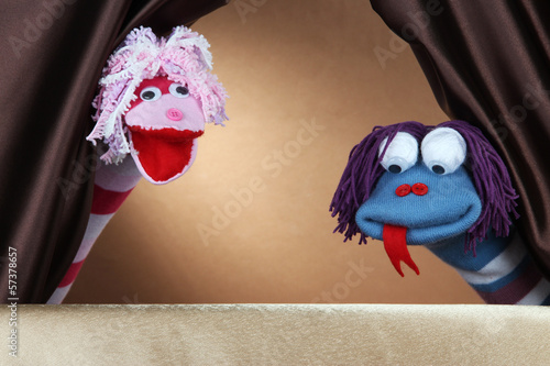 Puppet show on brown background