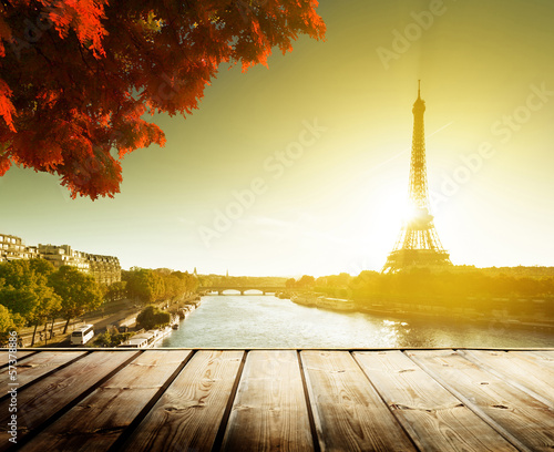 wooden deck table and Eiffel tower in autumn