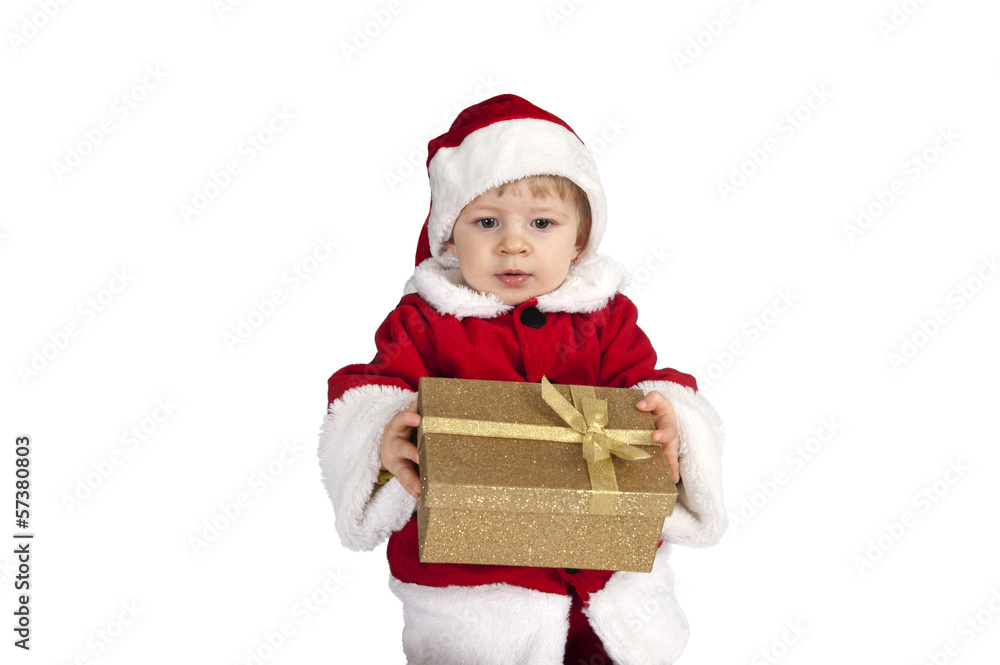 little toddler in xmas outfit giving a present little toddler in xmas outfit giving a present