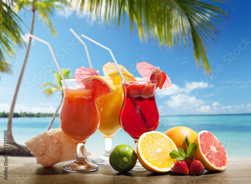 cocktails and tropical fruit on the beach