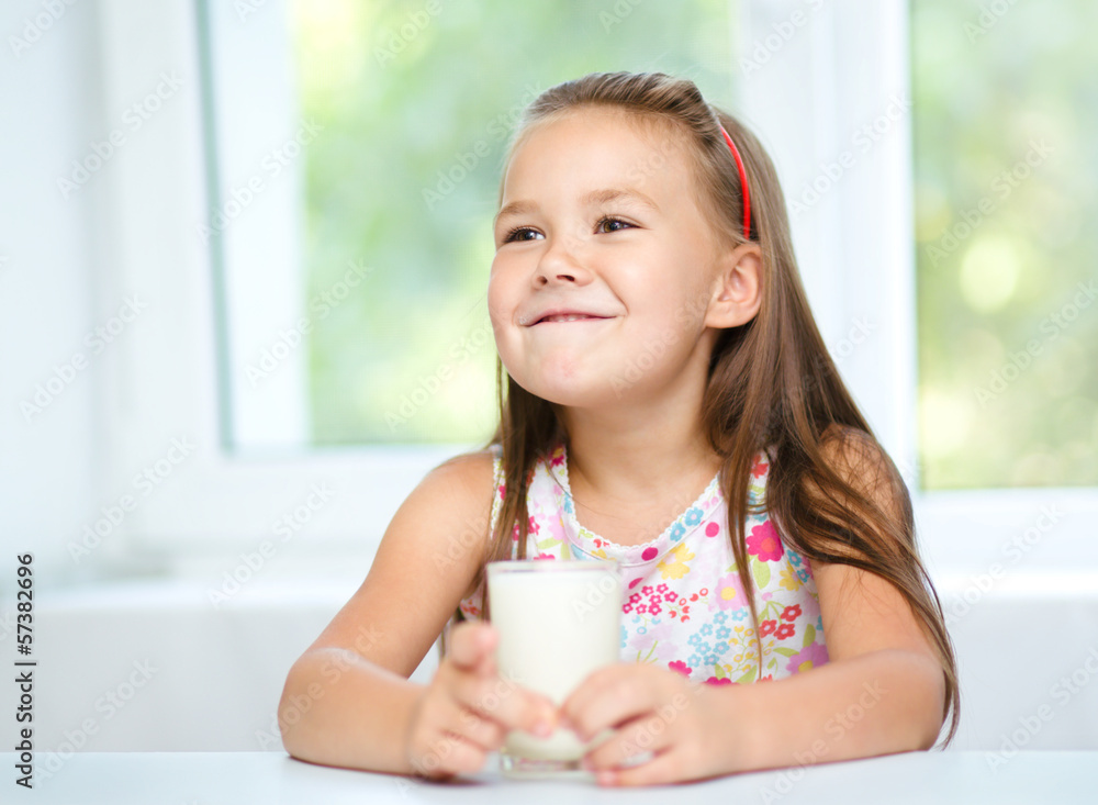 Cute little girl with a glass of milk Cute little girl with a glass of milk
