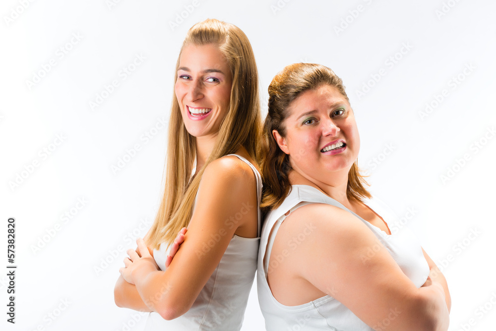 Thin and fat woman standing and smiling Thin and fat woman standing and smiling