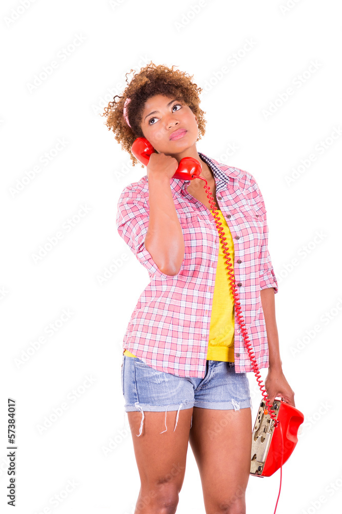 Portrait of a pretty black young woman talking on phone Portrait of a pretty black young woman talking on phone