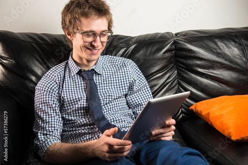 Very young executive using his tablet