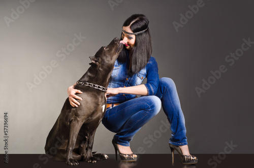Dog kissing a beautiful girl