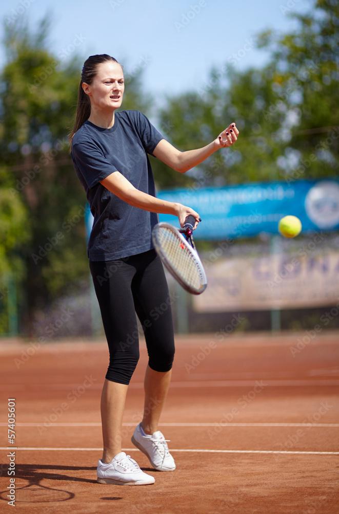 Tennis player executing a forehand volley