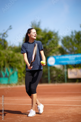 Tennis instructor teaching © Xalanx