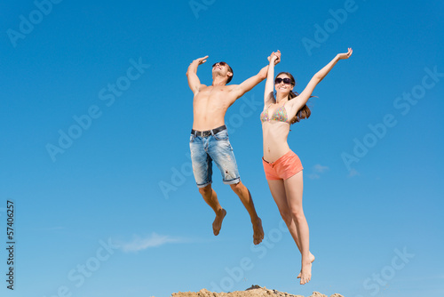 young couple jumping together