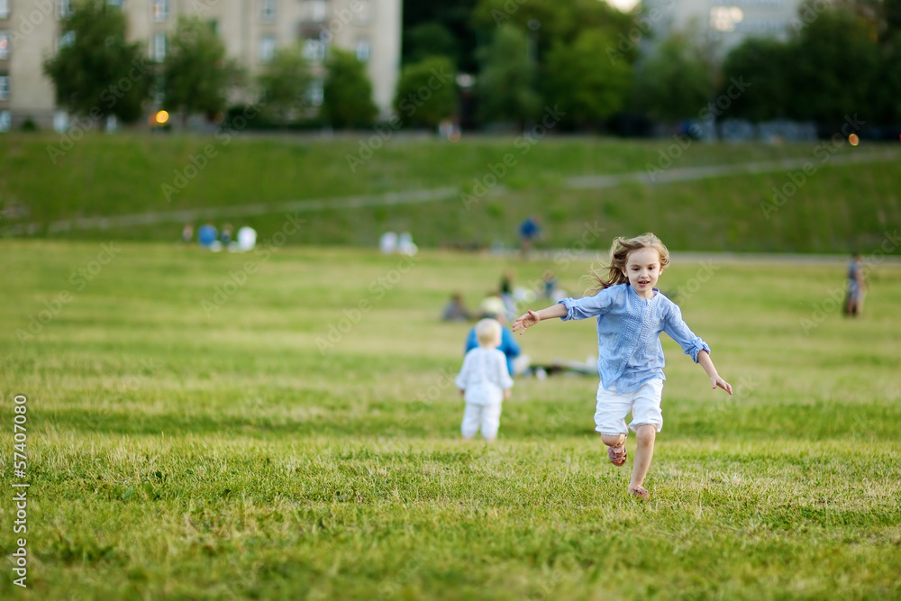Adorable girl running around outdoors Adorable girl running around outdoors