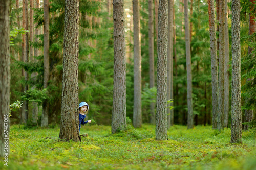 Adorable little girl hiking in the forest © MNStudio