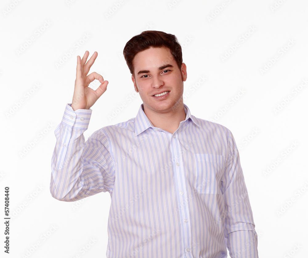 Charming man with ok gesture smiling Charming man with ok gesture smiling