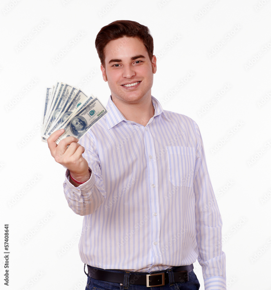 Handsome man holding dollars while smiling Handsome man holding dollars while smiling