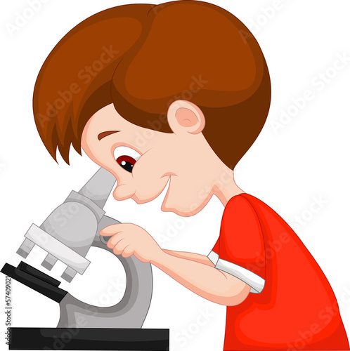 Young boy using microscope